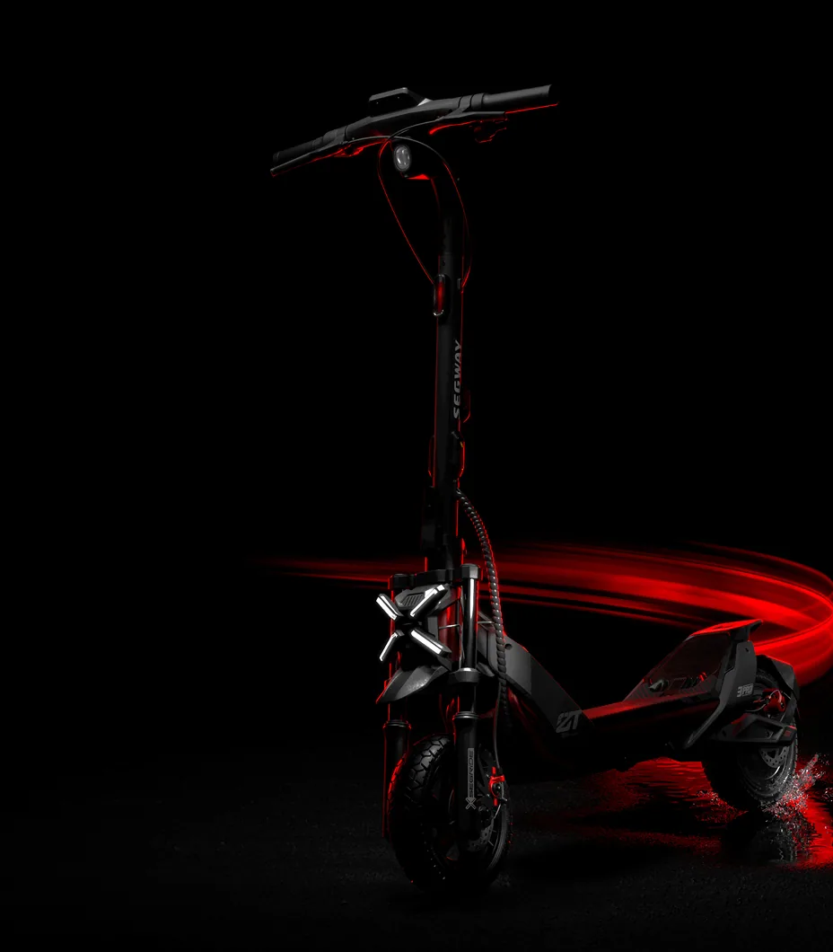 Trottinette électrique Segway ZT3 Pro E de trois quarts dans le noir, éclairée de rouge